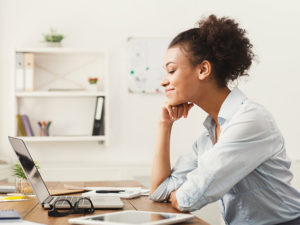 Smiling woman with laptop