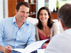 Friendly couple meeting with adviser.